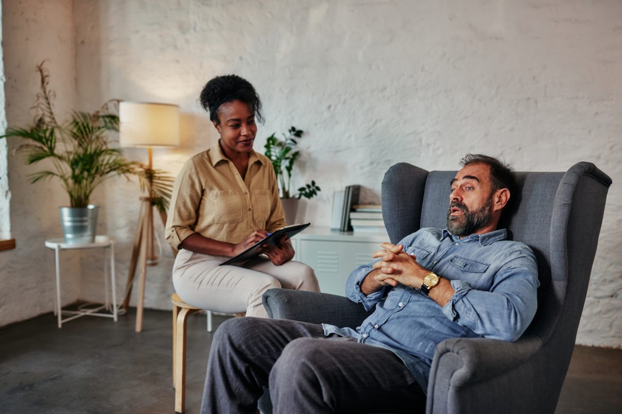 middle age talking with mental health psychotherapist