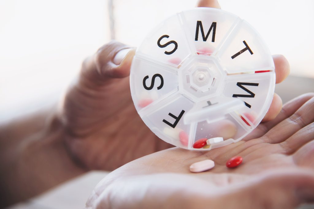 people prepare daily medicine tablet pillbox scaled
